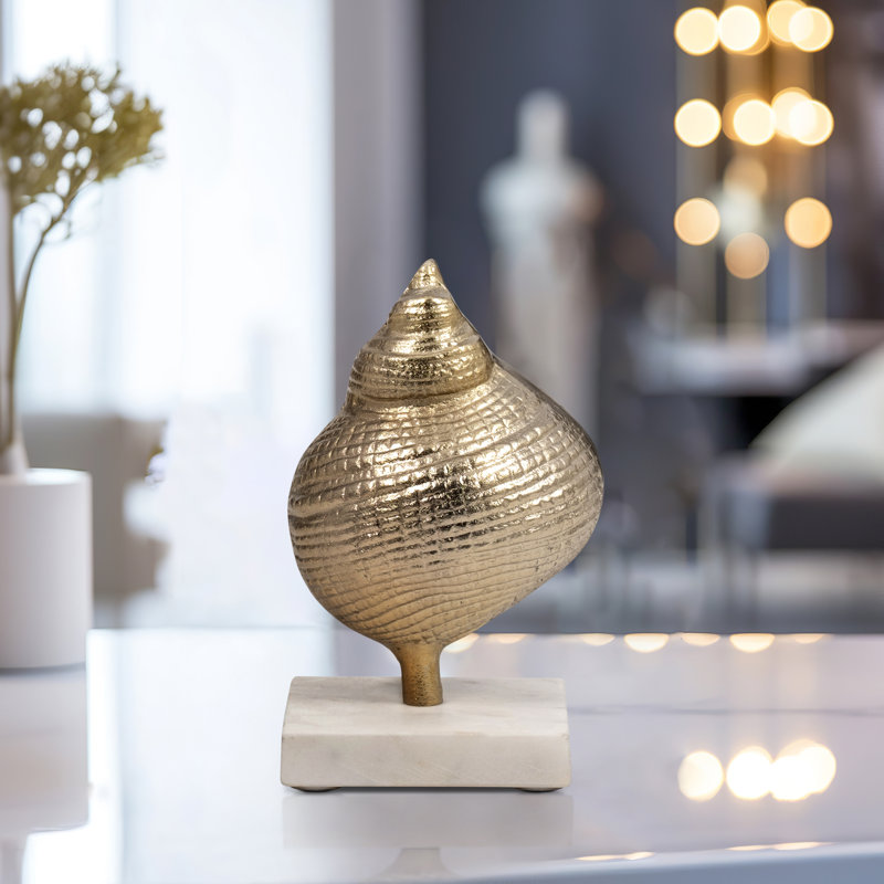 Figurine Metal and Marble Coastal Shell Design with Modern Spiraling Form on Solid Stone Base Inspired by Contemporary Nautical Trends in Mixed Materials Woods and Metals for Stylish Accent Decor
