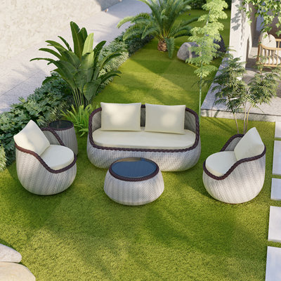 Korwin Wicker 4 - Person Patio Conversation Set with Cushions