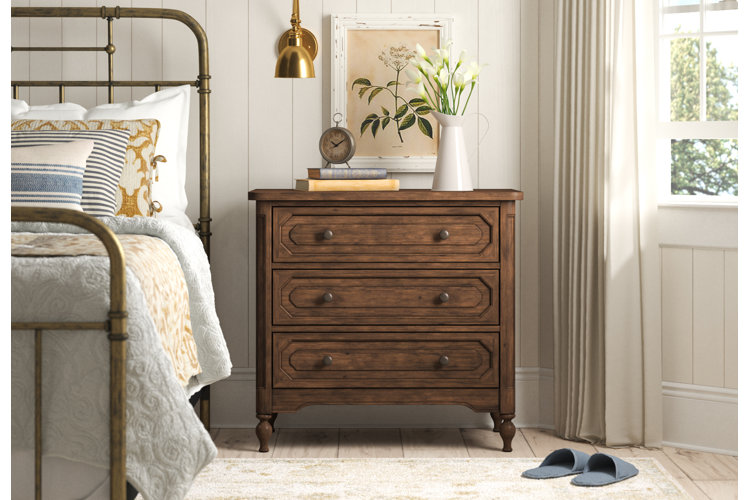 farmhouse-style bedroom with a rustic nightstand