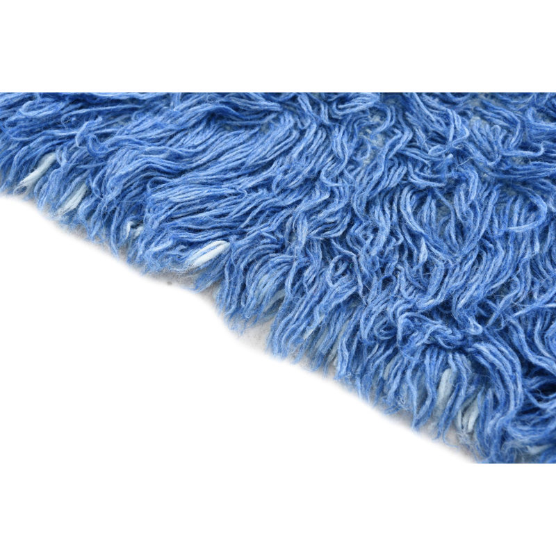 Tapis bleu Kalmanovitz