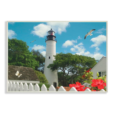 " Key West Light House With Picket Fence Butterfly And Seagull " by Alan Giana & Company