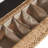 Boatwright 56'' W Flip Compartment Storage Rattan Upholstered Bench with Two Pillows and Solid Wood Feet
