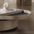 Light luxury creative rotating smiley tea table