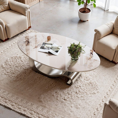 Table basse contemporaine contemporaine avec plateau luxueux en faux marbre et base artistique en acier inoxydable