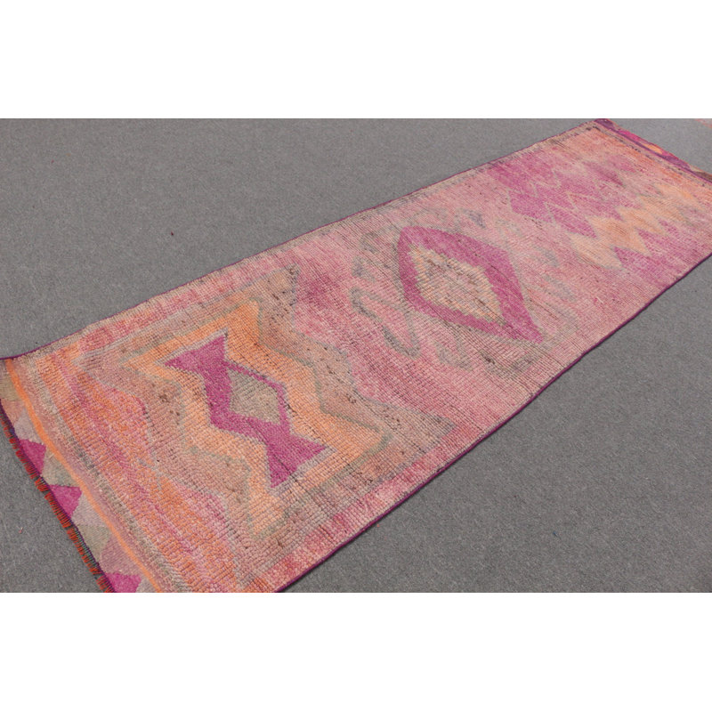 Explore The Beauty Of This Pink Turkish Herki Rug For Your Indoor Space With Tribal Designs