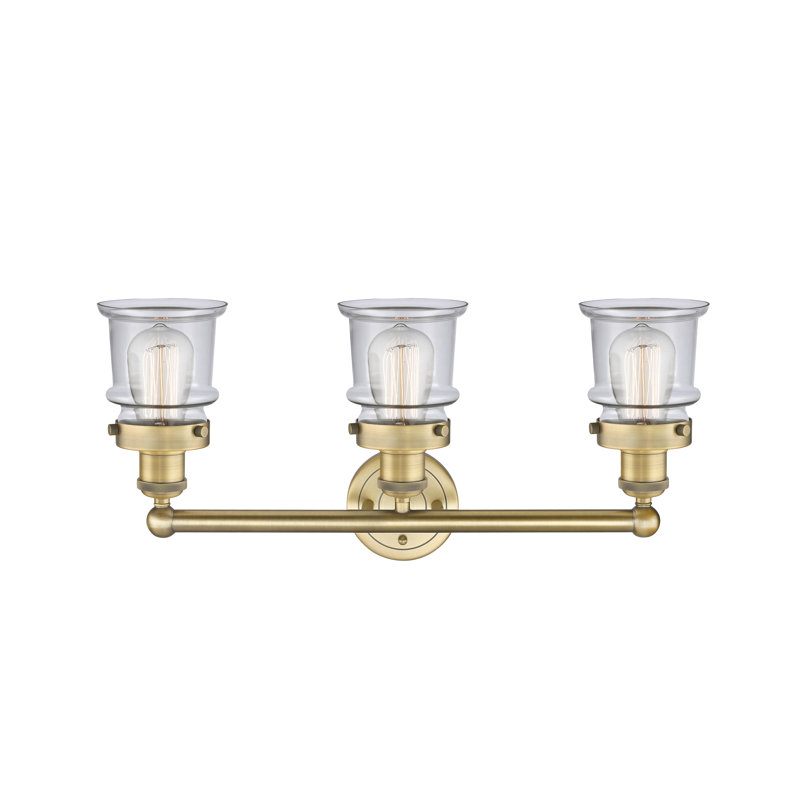Petit luminaire pour salle de bain 3 lumières Cailen de la collection Edison, Transparent, Laiton brossé