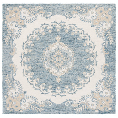 Ebony Floral Hand Tufted Wool Area Rug in Blue/Ivory