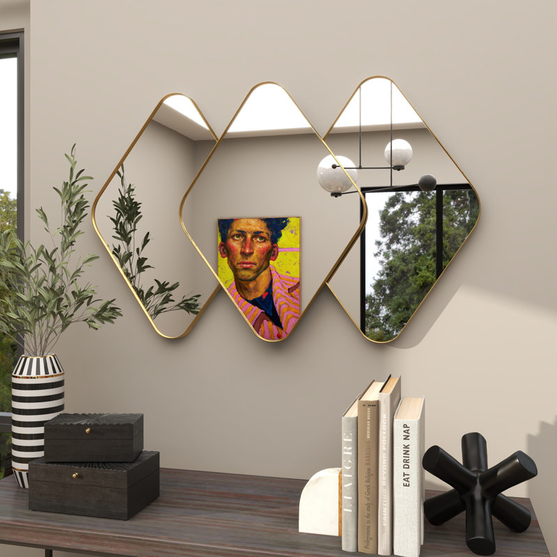 Miroir mural en métal doré