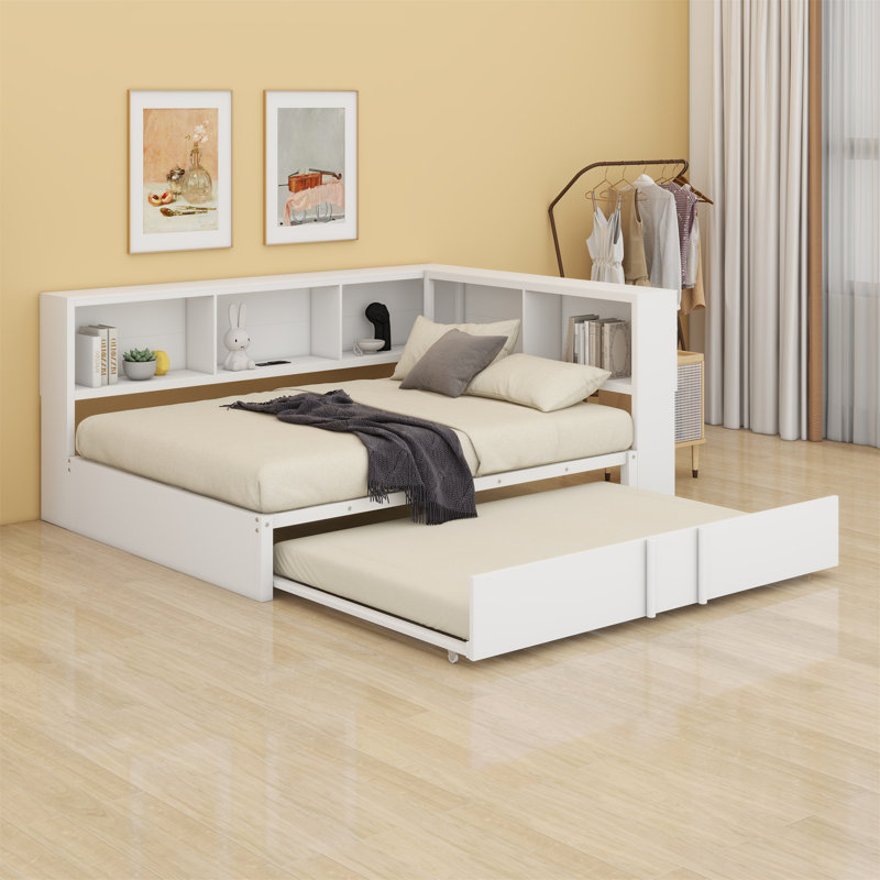 Un lit de jour en métal pleine grandeur qui comprend un lit gigogne intégré et des compartiments de rangement intégrés, Blanc