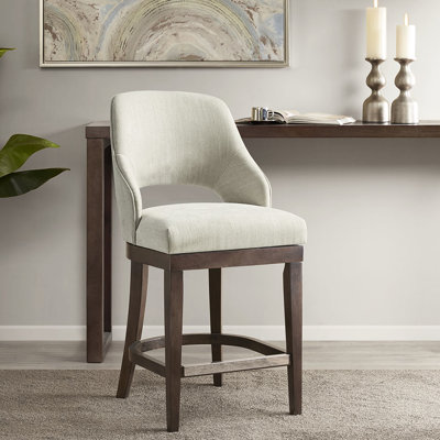 Élégant tabouret de comptoir à dossier ouvert recouvert de tissu d'ameublement crème avec pieds en bois massif