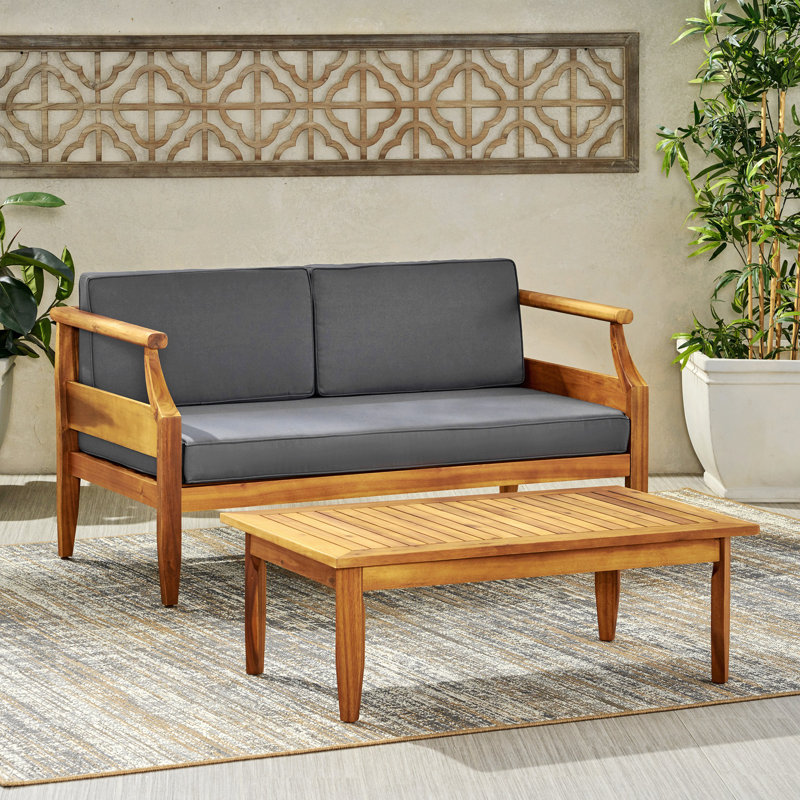 Ensemble de causeuse d'extérieur en bois d'acacia Aston_ Causeuse et table basse - finition teck + coussin gris foncé