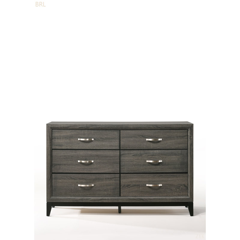 Rehaussez votre espace avec cet élégant meuble en bois gris, mis en valeur par des poignées métalliques polies