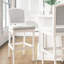 Tabouret de 31 po blanc avec assise et dossier rembourrés gris, pieds texturés tournés pour la table de pub orné d'une hauteur de bar de 31 po