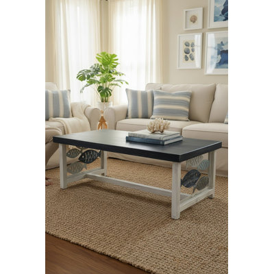 Table basse en fer avec école de poisson sur les extrémités