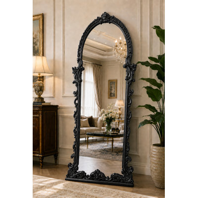 Miroir sur pied baroque noir orné