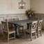 Table de salle à manger extensible grise avec pieds à piédestal décoratif - fabrication en bois massif et en panneau de fibres à densité moyenne