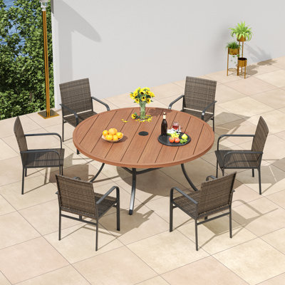 6-Person Patio Dining Set with 53" Round Metal Dining Table and 6 Stackable Rattan Armrest Chairs