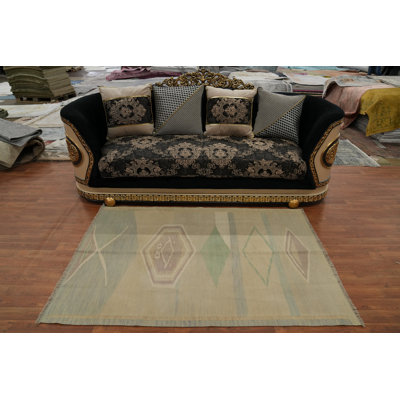 Tapis géométrique en laine tissé à la main aux teintes douces 4 x 6