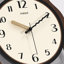 Horloge murale brune-129417711