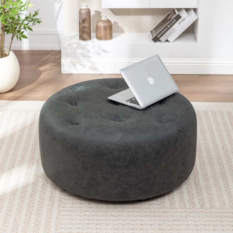 Castanedo Upholstered Round Ottoman, Polyester - Vintage Black