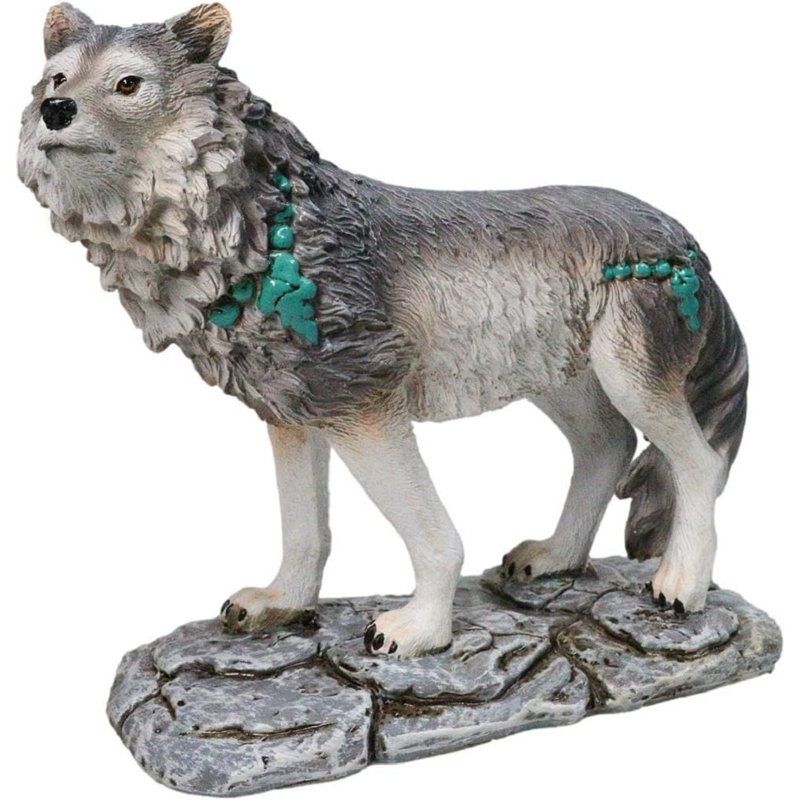 Figurine loup gris avec des roches turquoise sur le sol
