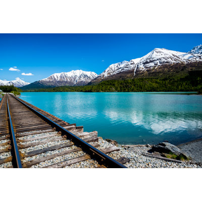 Railroad Track With Lake And Mountain Range - Wrapped Canvas Print