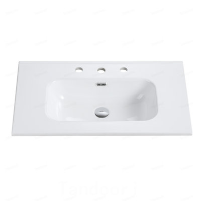 Integrated white ceramic basin with three predrilled faucet holes, faucet and drain assembly NOT included