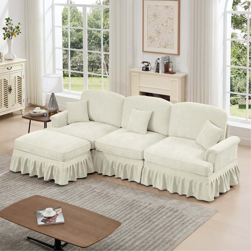 Canapé modulaire en forme de L Mid-Century à trois places avec accoudoirs évasés et volants amovibles, avec jupes plissées et pieds fuselés, canapé en chenille confortable à 3 sièges profonds avec repose-pieds mobile, blanc beige