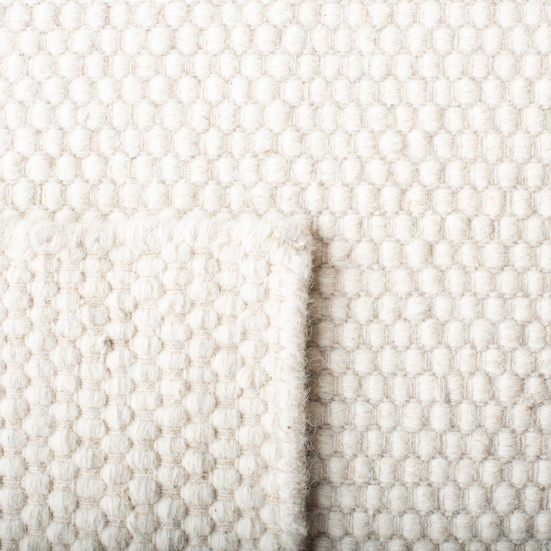 Ivory Tufted Handmade Wool Area Rug 5' x 8'