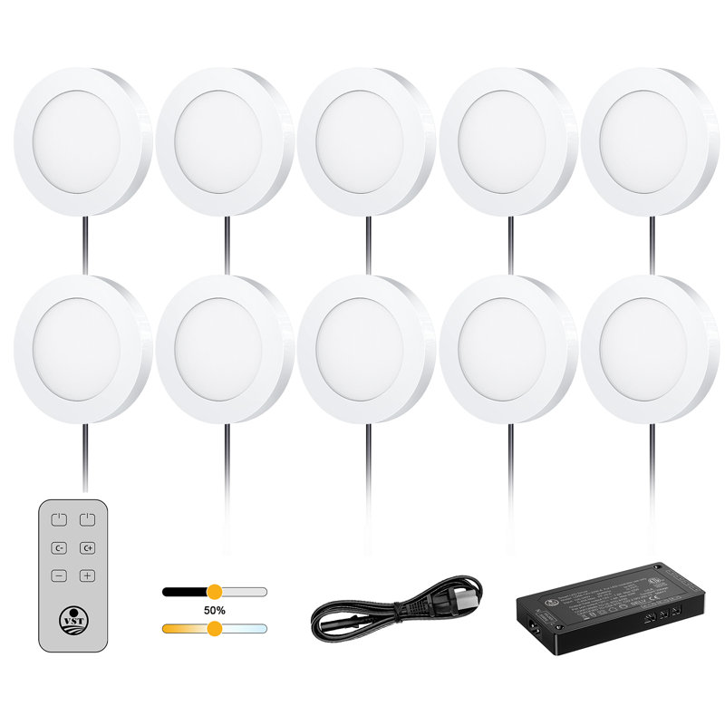 Ten white LED puck lights with a wireless remote control, power cable, and LED driver.