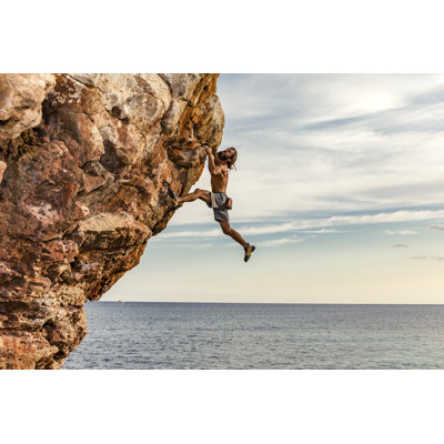 Psicobloc Rock Climber at the Sea by Aluxum - Wrapped Canvas Art Prints