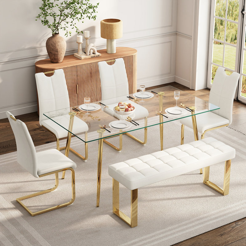 Ensemble de salle à manger en verre pour 4 à 6 personnes, de style moderne, comprenant une table de cuisine rectangulaire en verre, des chaises rembourrées en similicuir et un banc.