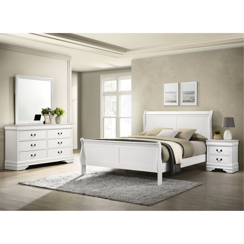 Chambre à coucher Queen 4 blanche, comprenant lit, table de chevet, commode et miroir, cadre de lit ajustable, tête de lit à panneaux blancs, quatre tiroirs de rangement avec accents décoratifs.