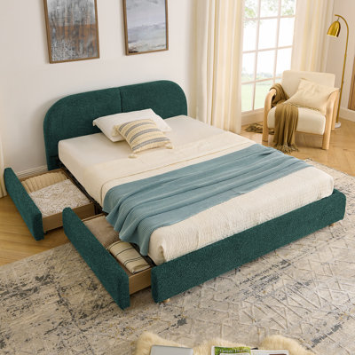 Grand lit plateforme tapissier vert avec tête de lit courbée et rangement pour tiroir