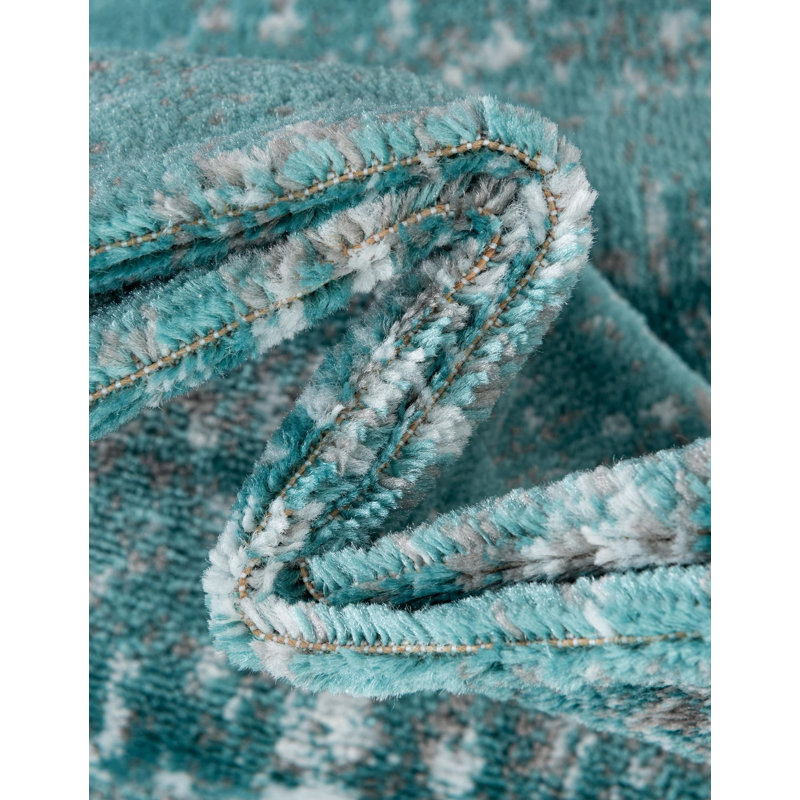 Tapis floral turquoise Brandt, Ovale 7 pi 10 po x 10 pi