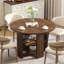 Table de salle à manger extensible ronde à ovale de 109 à 150 cm de large pour 4 à 6 personnes, avec rangement dissimulé et piètement en croix, style ferme moderne.-279206078