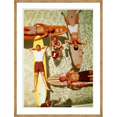 Getty Images " Men On Surfboards In Pool Sipping Drinks " by Getty Images