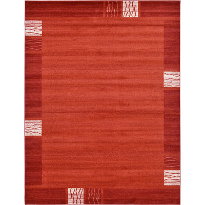 Tapis à motif géométrique rouge rouille