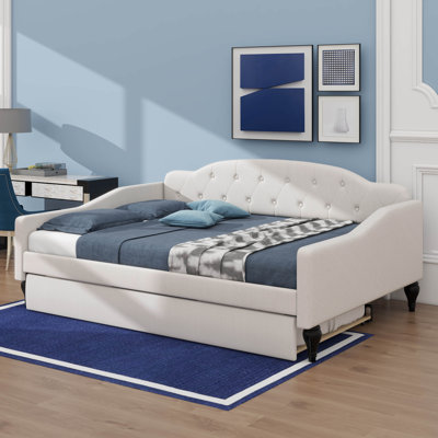 A Full-Size Upholstered Daybed Integrated Twin-Size Trundle