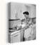1950s WOMAN HOUSEWIFE IN KITCHEN APRON MIXING BAKING INGREDIENTS IN BOWL by H. Armstrong Roberts - Wrapped Canvas Print-1629846197