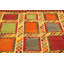 Tapis orange / jaune à motif géométrique en laine Aakiyah
