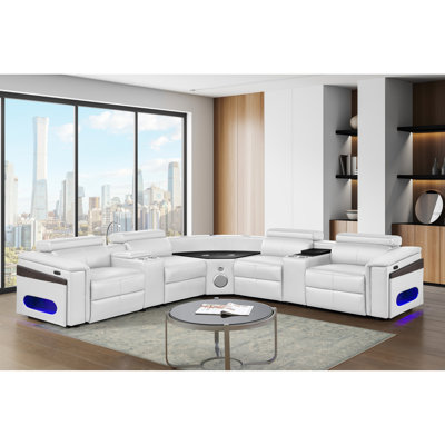 Canapé modulaire en L 4 blanc, revêtement en similicuir, structure en bois, siège mi-ferme, 2 appuis-tête réglables manuellement, coussin de recharge sans fil, ports, haut-parleur, barre éclairée à DEL, rangement pour accoudoirs 4