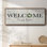 Welcome to Our Home- Framed Canvas