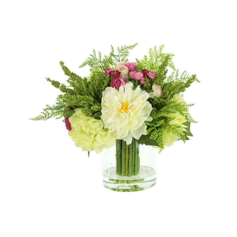 Peony, Hydrangea And Ranunculus Floral Arrangement In A Clear Glass Vase