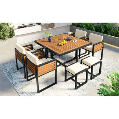 9-Pieces Acacia Wood Patio Dining Set with Cushioned Chairs, Ottomans, and Square Table for Outdoor Use by Hokku Designs