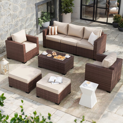 5-Person Outdoor Wicker Seating Group with Storage Deck Box and Ottomans