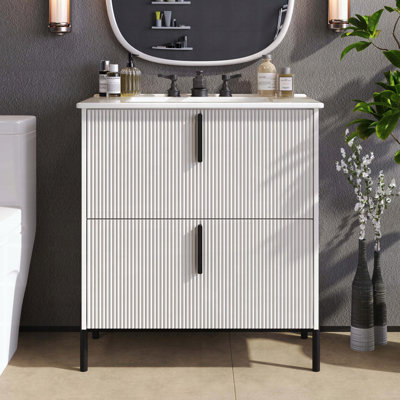 Meuble-lavabo de salle de bain avec lavabo en céramique, tiroirs cannelés et glissières à fermeture en douceur