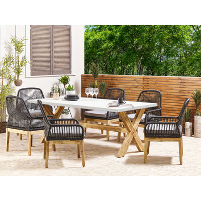 Monsey 6 - Person Acacia Rectangular Stone Patio Dining Set with Cushions included