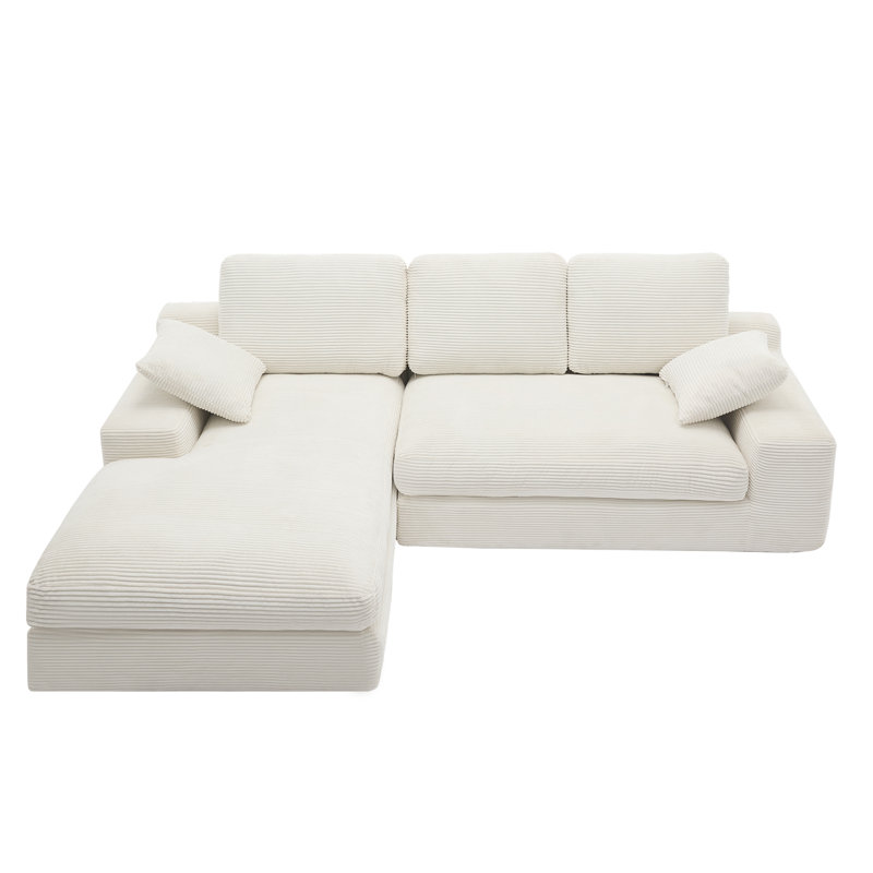 Canapé blanc en velours côtelé compressé. Il a une sensation d'assise douce et agréable pour la peau, ajoutant une atmosphère de guérison au salon chaleureux. Il est livré avec 3 coussins de dossier et 2 coussins décoratifs.