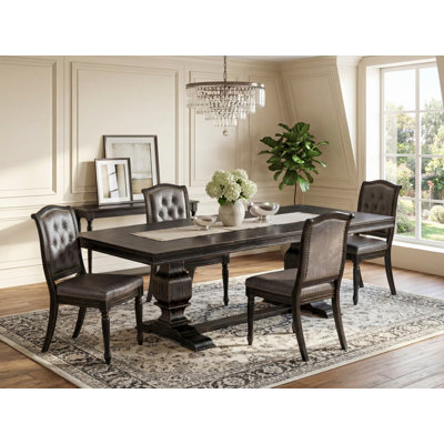 L'ensemble de table de cuisine 5 pièces se compose d'une table de salle à manger et de 4 chaises modernes en similicuir gris foncé avec dossier capitonné - Finition sable
